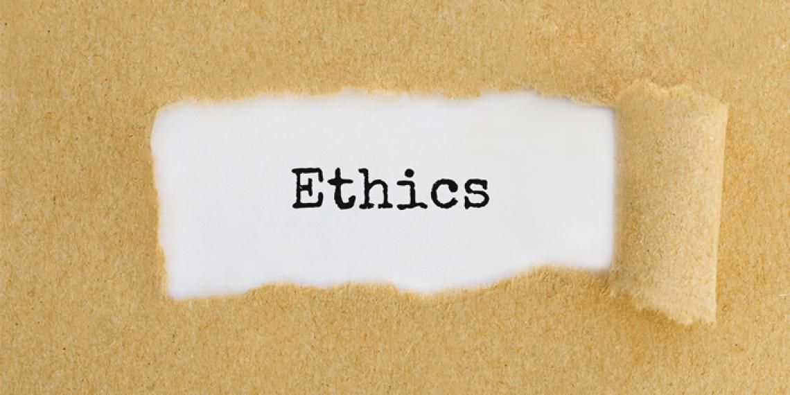 the word ethics written on paper